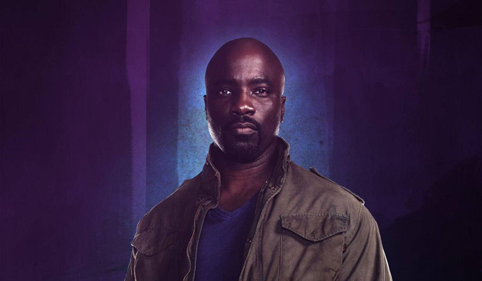 Luke Cage, green jacket, moody purple and blue lit background, HD Desktop Wallpaper