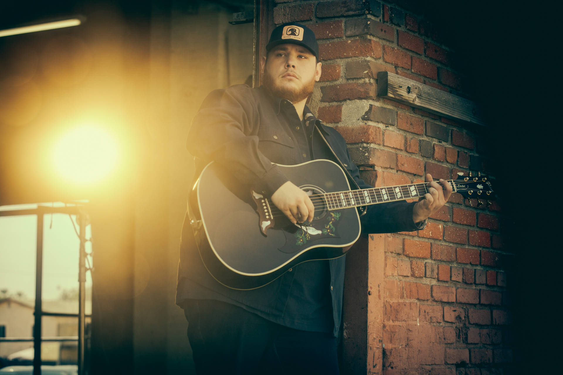 Luke Combs, acoustic guitar, brick wall, Full HD Desktop Wallpaper