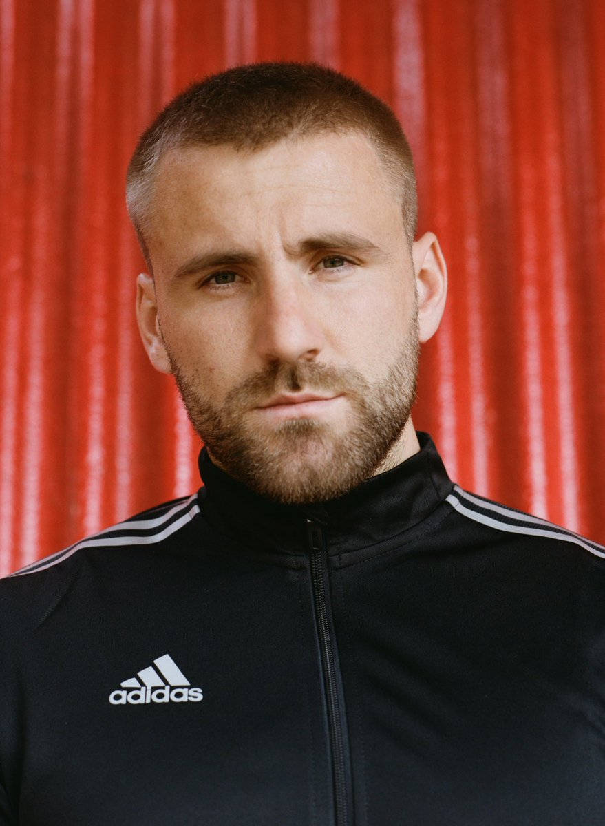 Luke Shaw, black Adidas track jacket, vibrant red curtain, SD Phone Wallpaper