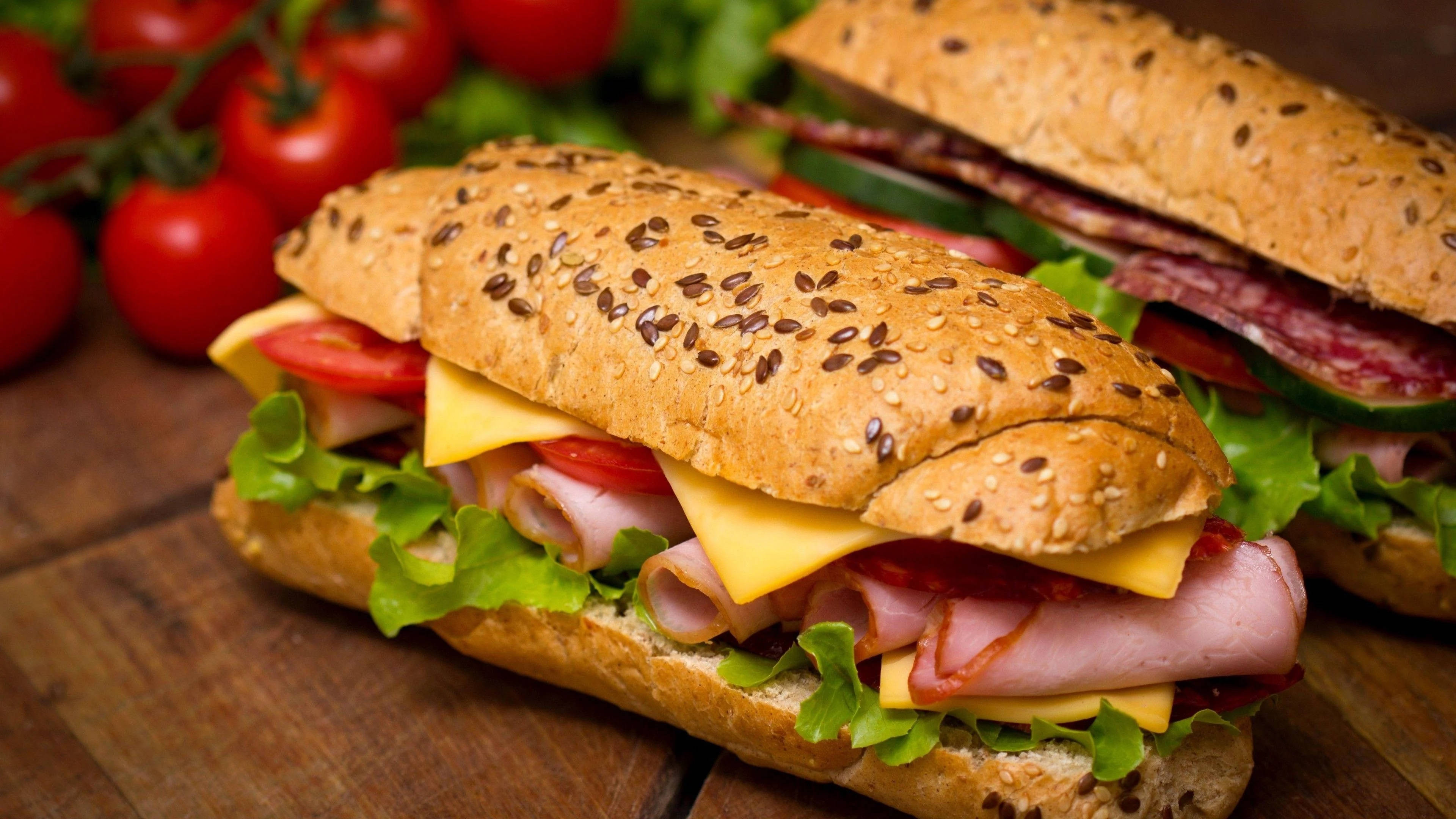 sesame seed baguette, ham cheese tomato and lettuce, wooden board, 4K Desktop Wallpaper