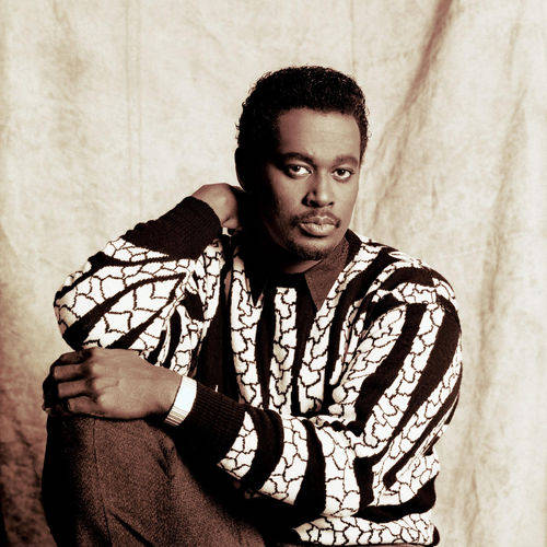 Luther Vandross, black and white patterned sweater, textured beige backdrop, SD Desktop Wallpaper