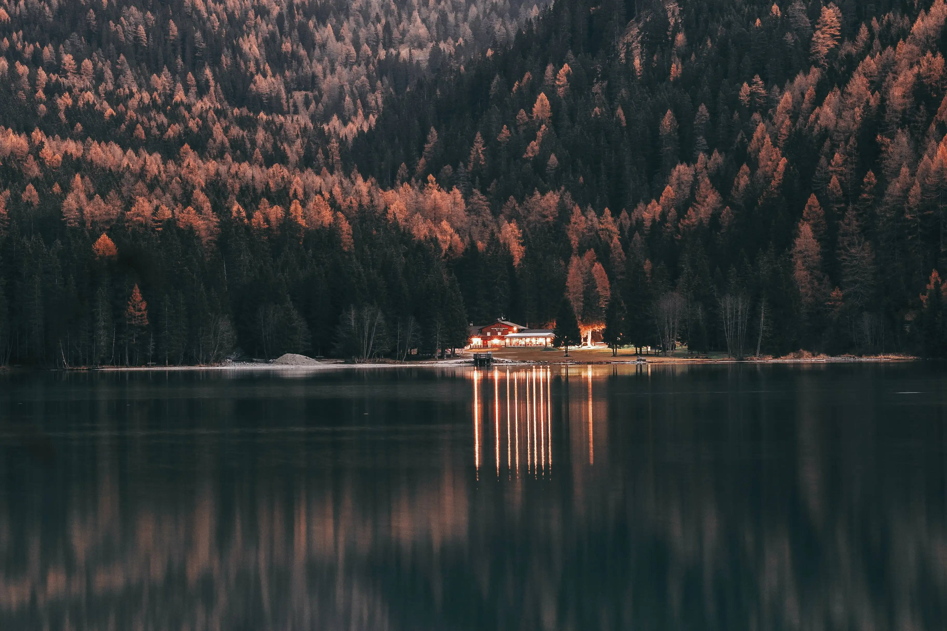 MacBook Air 4K, lakeside cottage, autumn-hued forest hills, 2K Desktop Wallpaper