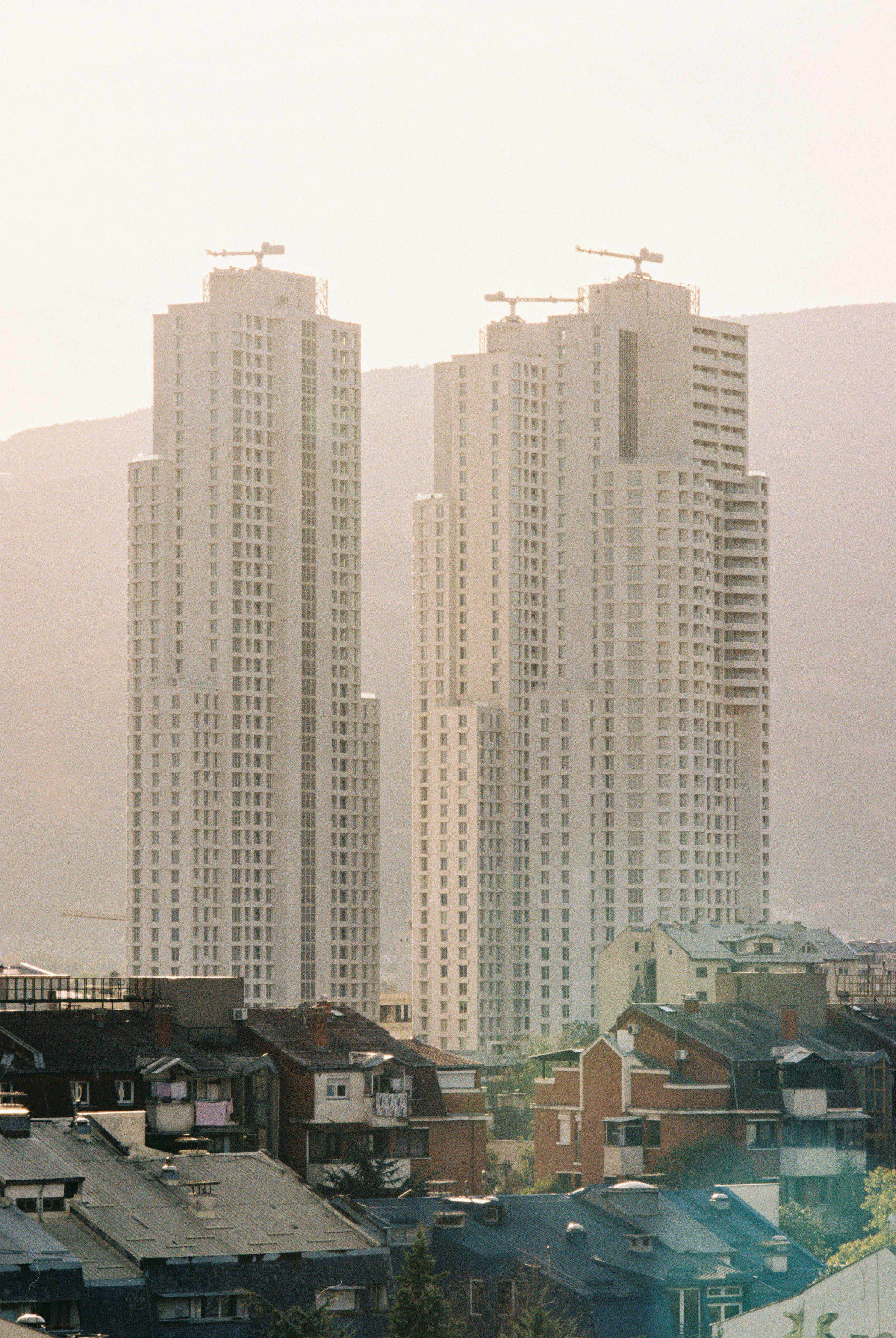 Macedonia, two white skyscrapers, under construction, 2K Phone Wallpaper