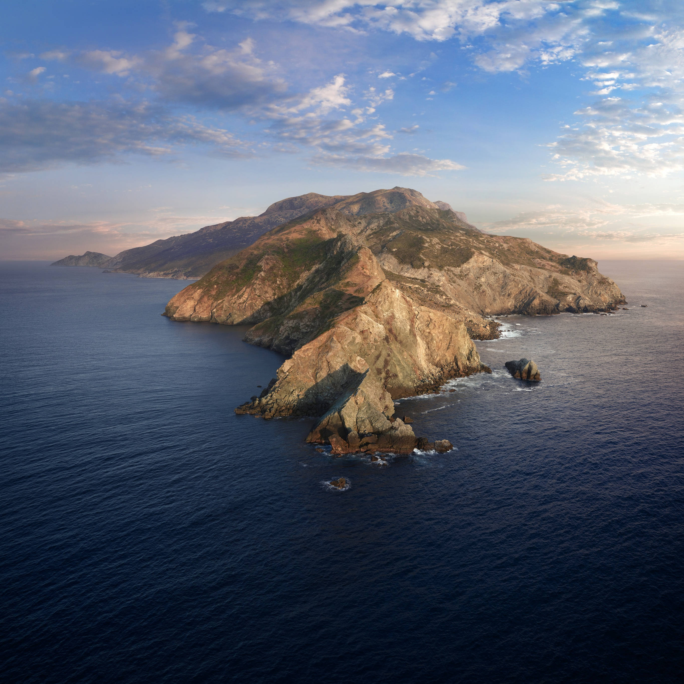 macOS Catalina, sunset, rugged mountainous island, 2K Desktop Wallpaper