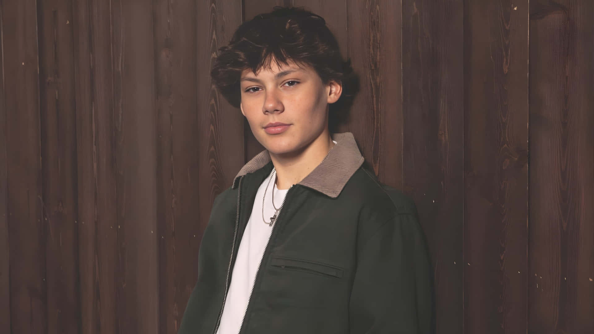 Maddox Batson, curly brown hair, dark wooden wall, Full HD Desktop Wallpaper