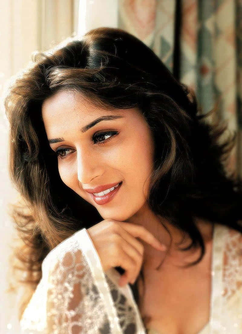 Madhuri Dixit, dark wavy hair, gentle smile, SD Phone Wallpaper