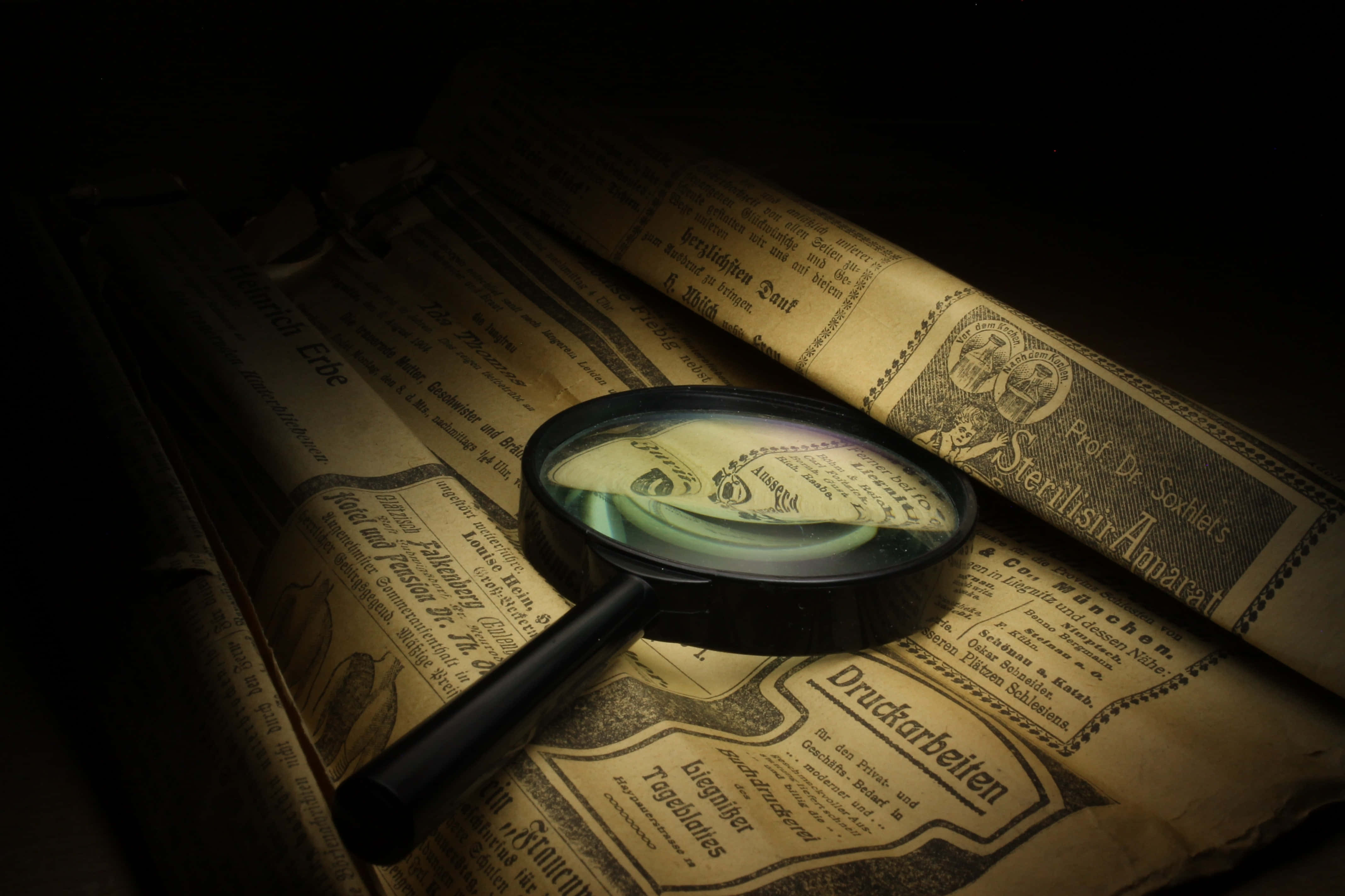 magnifying glass, vintage German newspaper rolls, dim light, 4K Desktop Wallpaper
