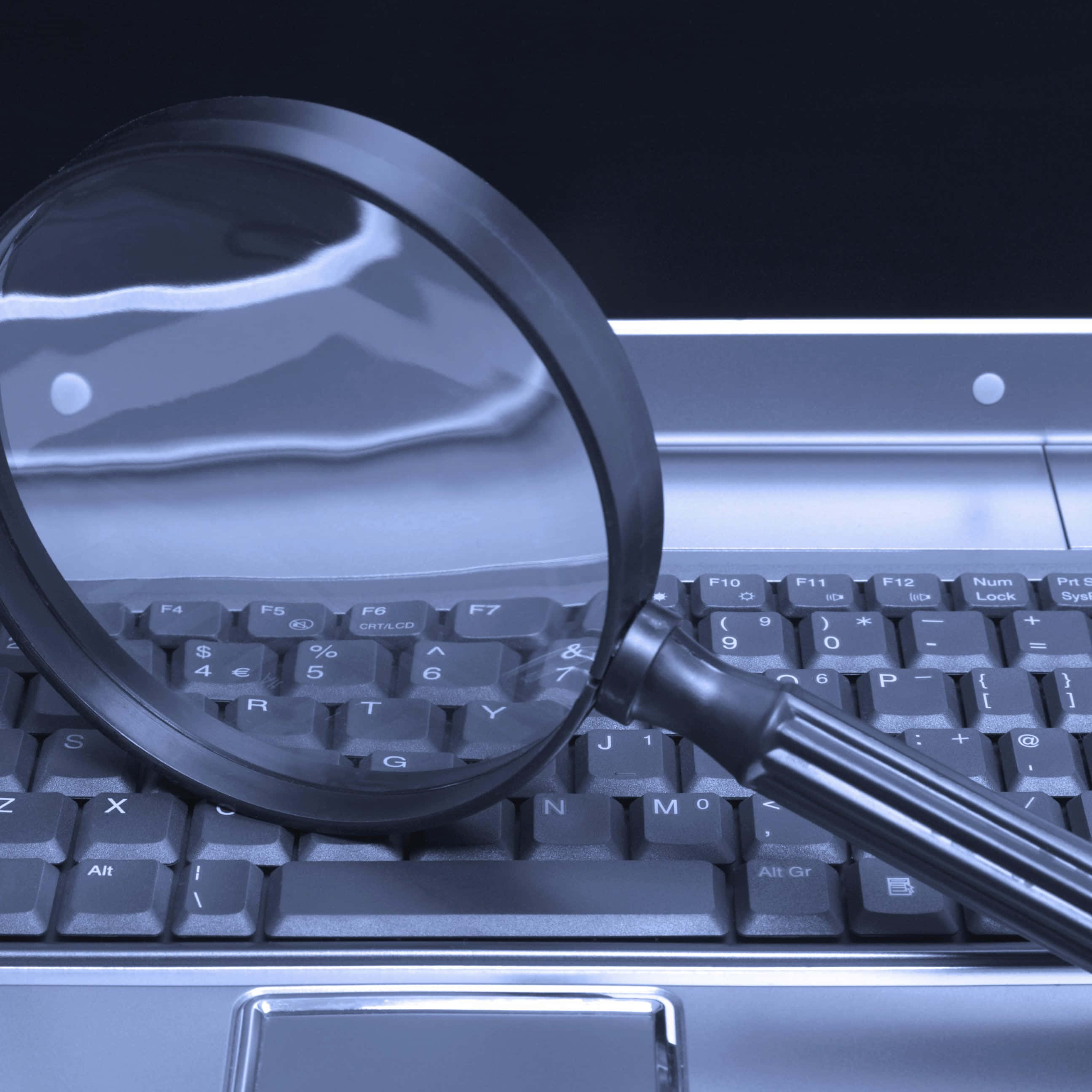 magnifying glass, laptop, cool blue tint, 2K Desktop Wallpaper