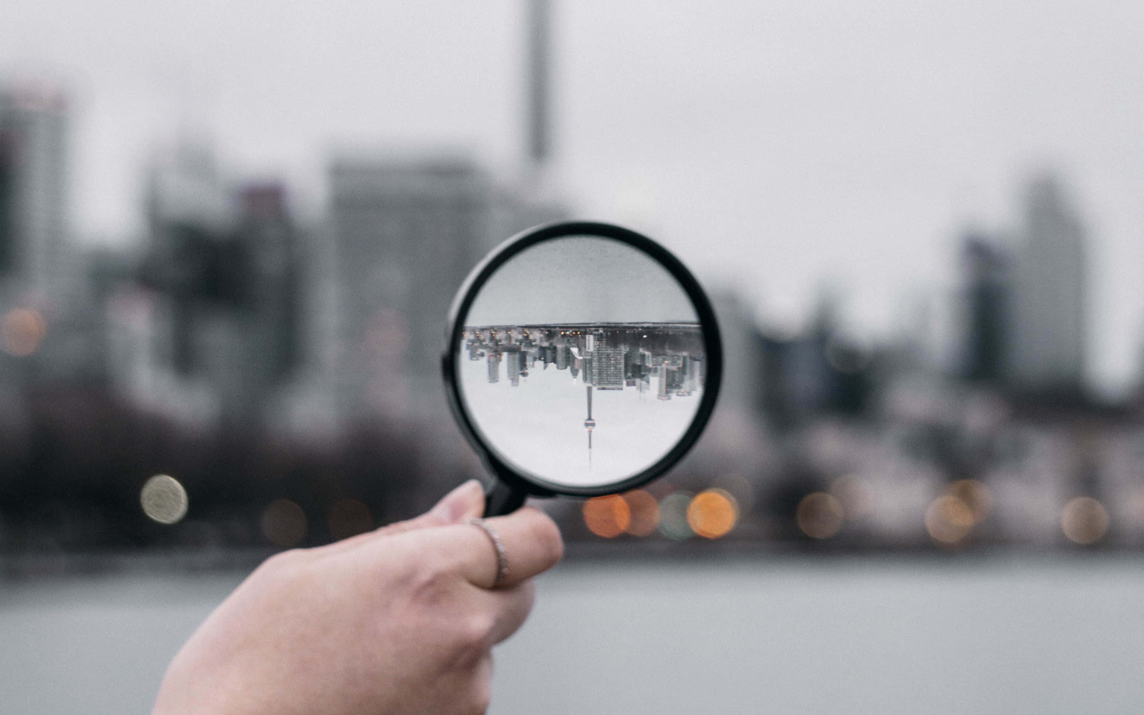 magnifying glass, inverted city skyline, water, 4K Desktop Wallpaper