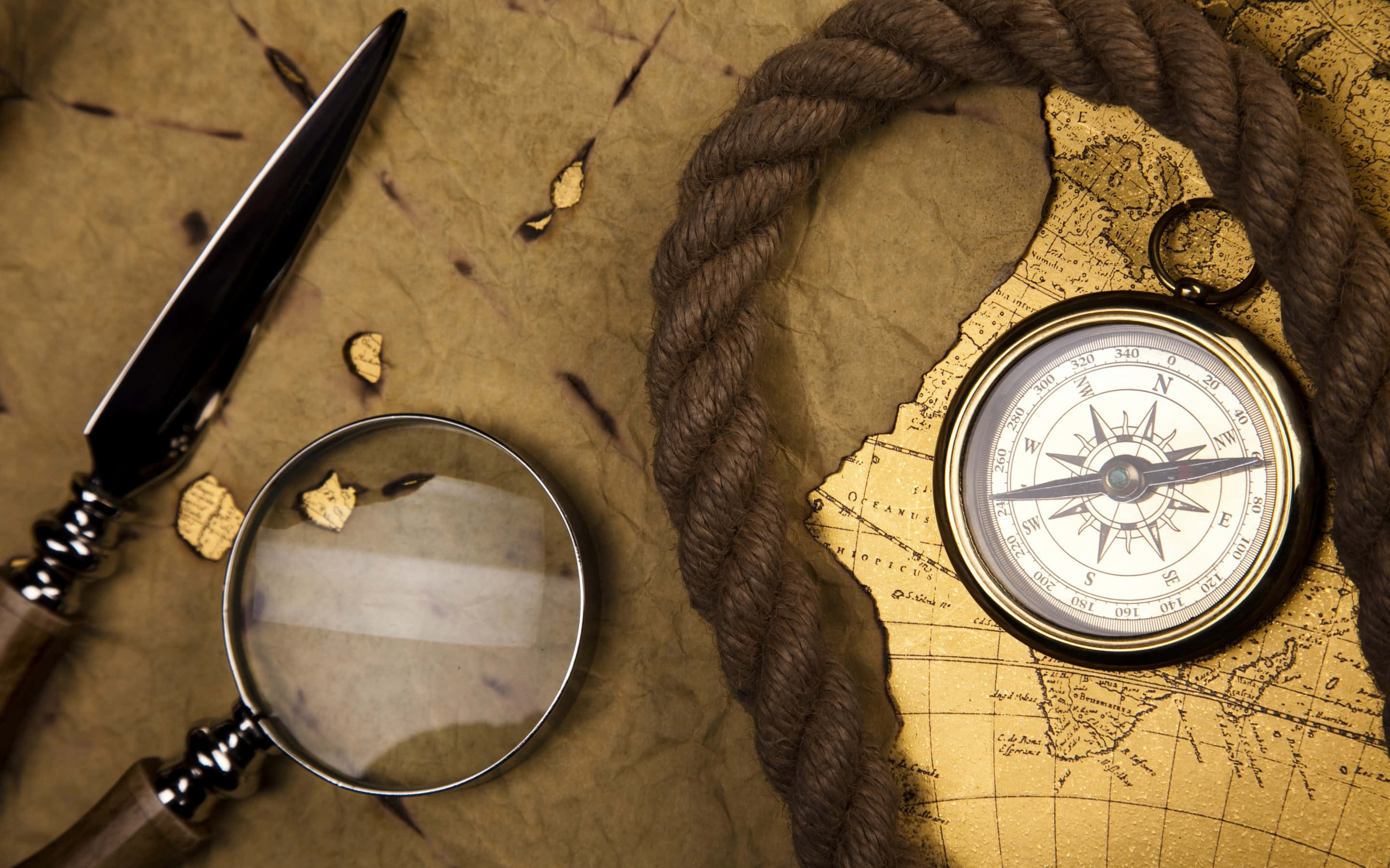 vintage compass, magnifying glass, aged map, 2K Desktop Wallpaper