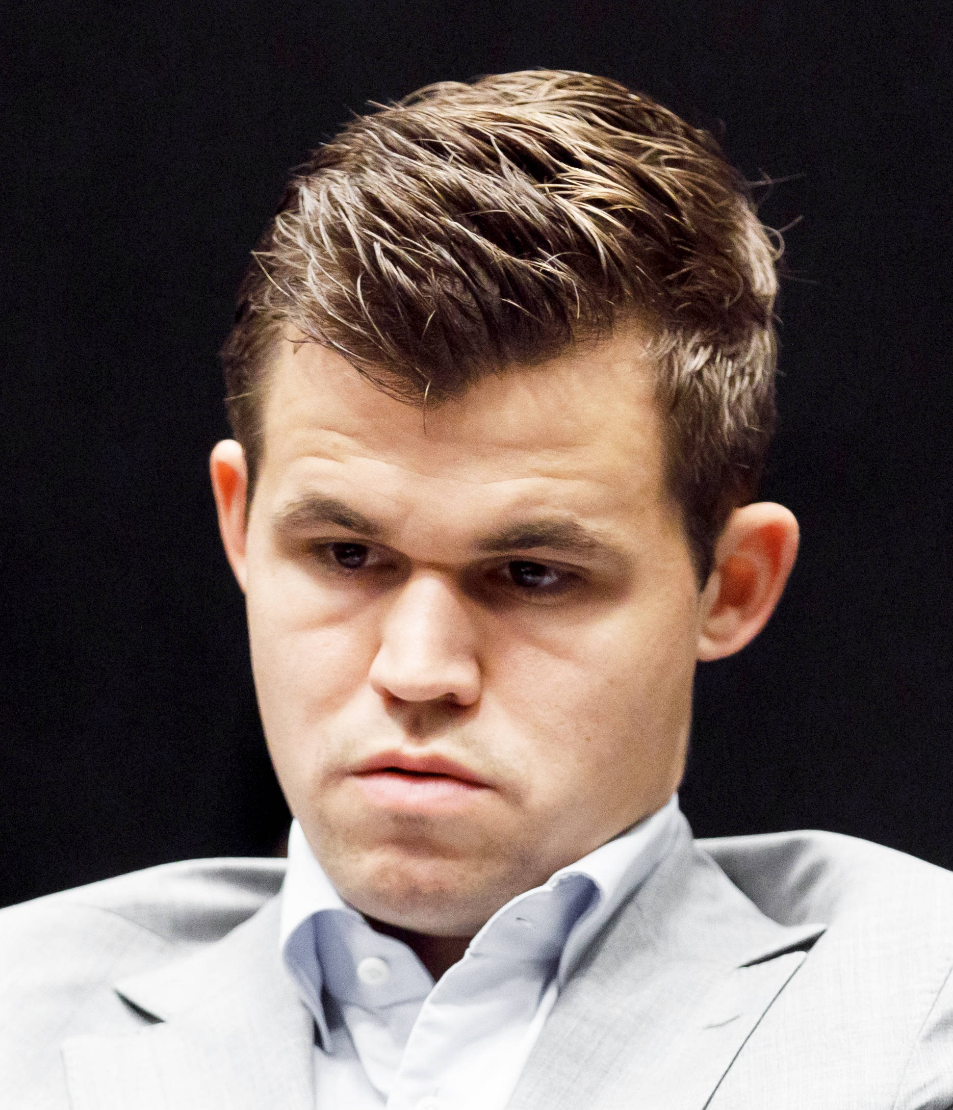 Magnus Carlsen, light gray suit, serious frowning expression, Full HD Phone Wallpaper