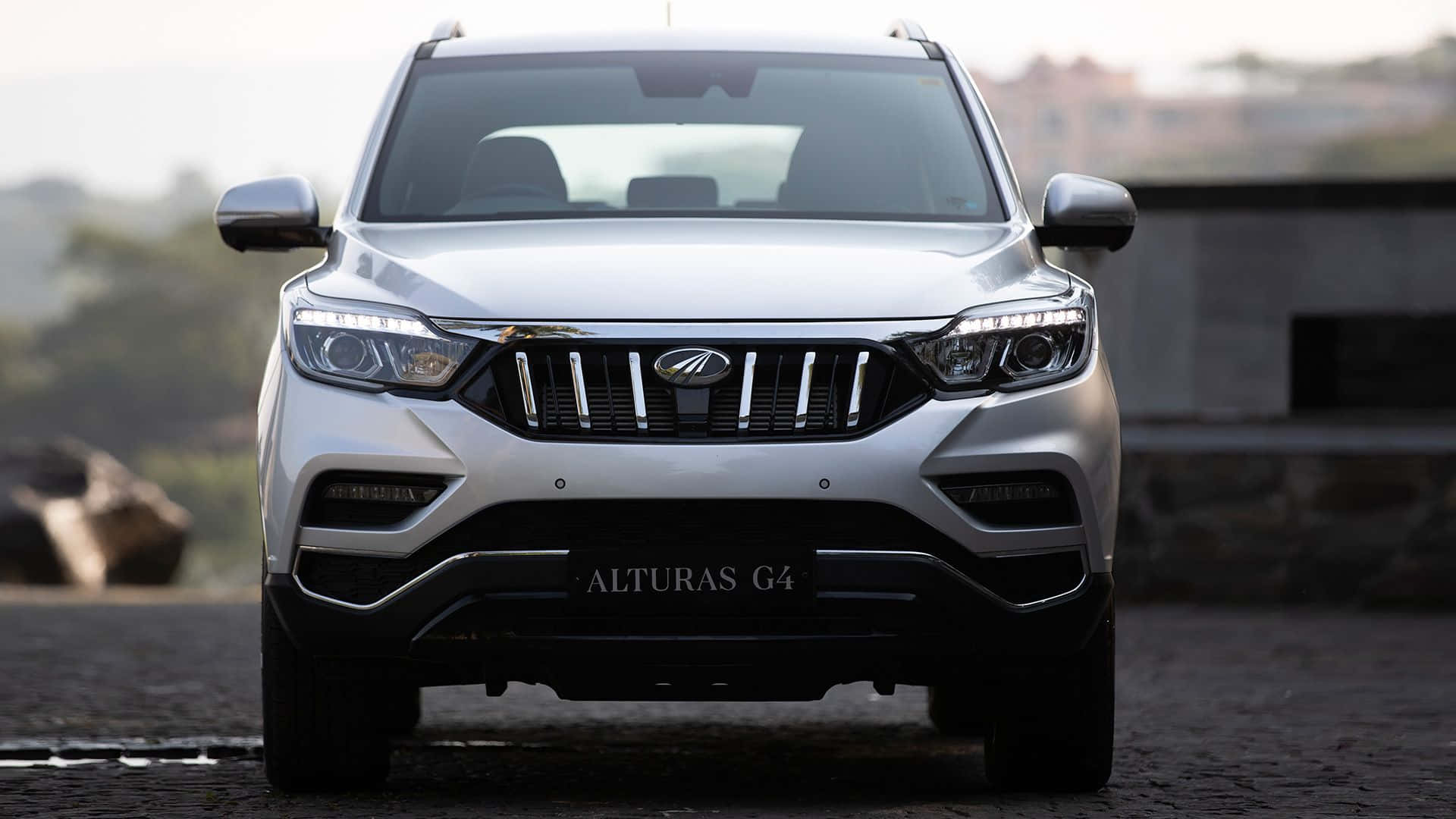 Mahindra Alturas G4, sleek silver SUV, cobblestone surface, Full HD Desktop Wallpaper