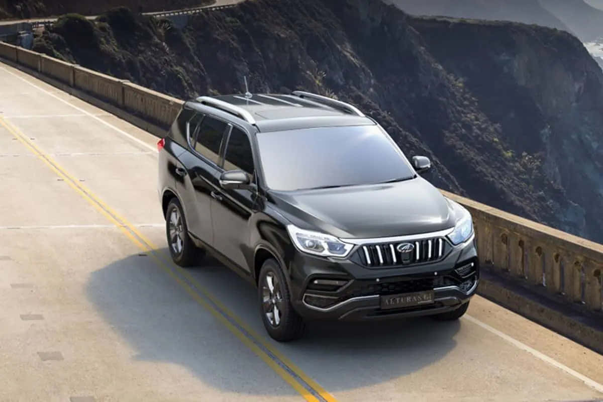 Mahindra Alturas G4, coastal road, sleek black SUV, SD Desktop Wallpaper