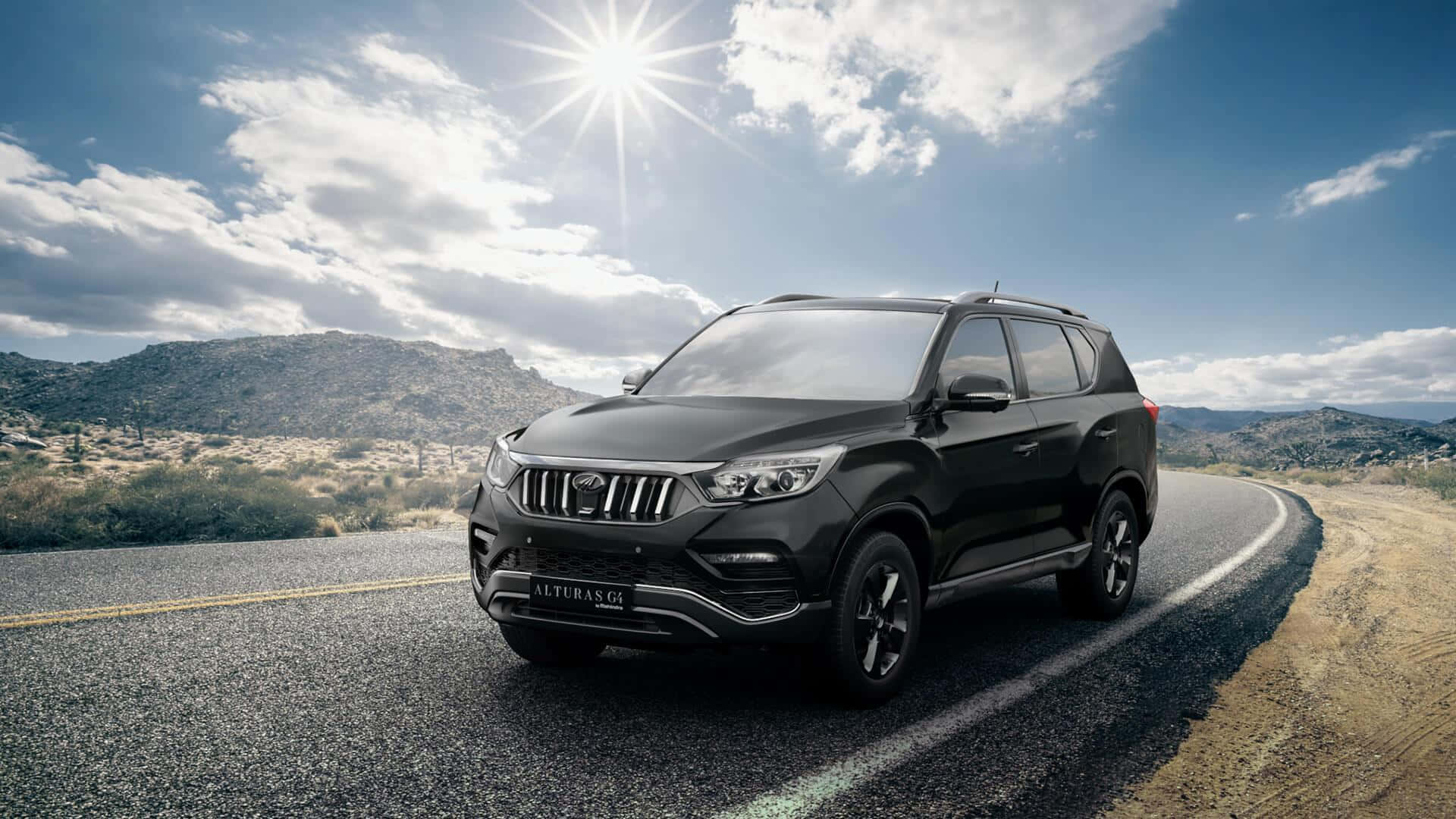 Mahindra Marazzo, sleek black SUV, winding mountain road, Full HD Desktop Wallpaper