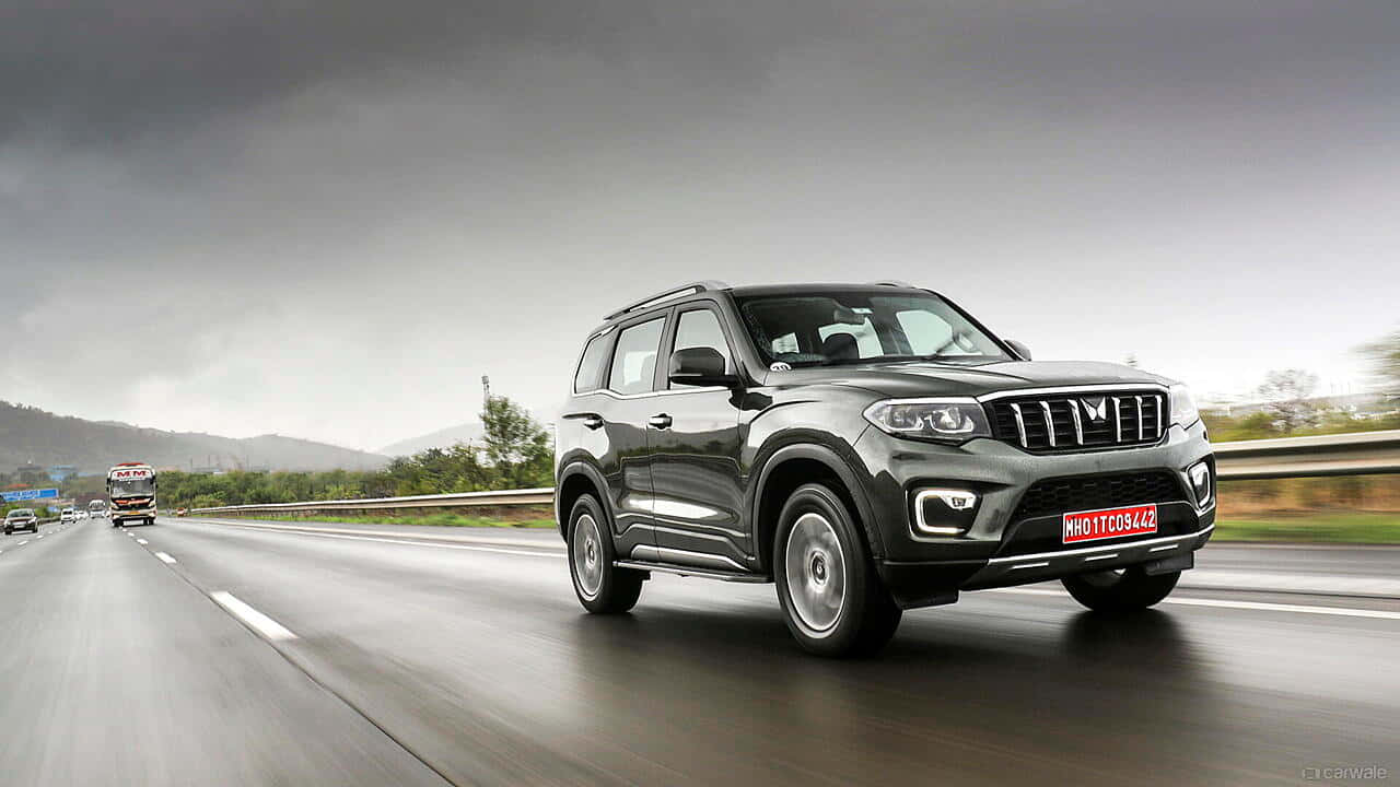 Mahindra Scorpio, sleek gray SUV, wet highway, HD Desktop Wallpaper