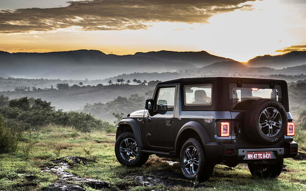 Mahindra Scorpio, black SUV, grassy terrain, SD Desktop Wallpaper