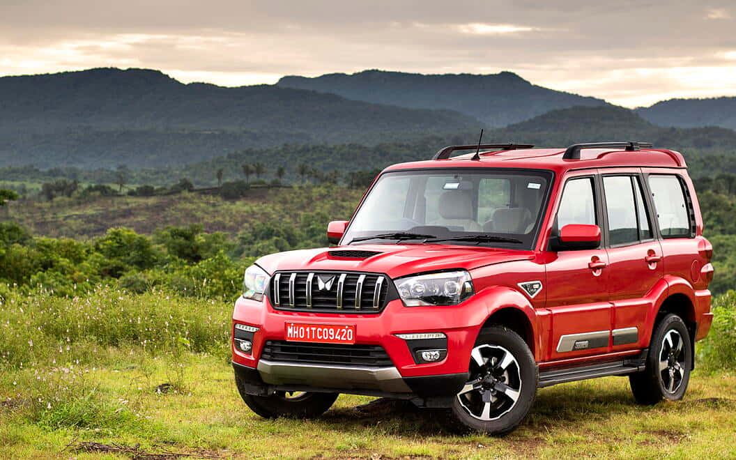 Mahindra Scorpio, vibrant red, grassy terrain, SD Desktop Wallpaper