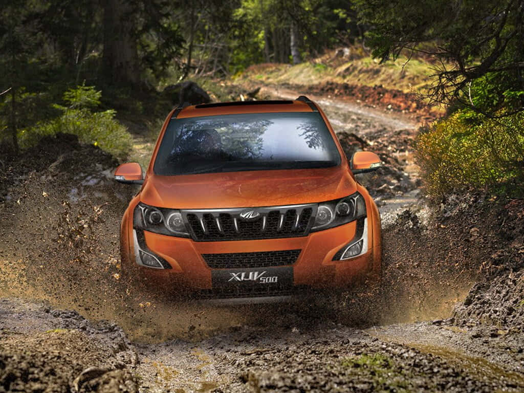 Mahindra XUV500, orange SUV, muddy forest trail, SD Desktop Wallpaper