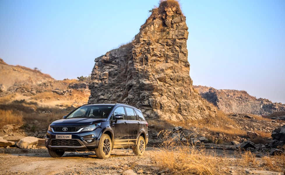 Mahindra XUV500, sleek black SUV, rugged dirt trail, SD Desktop Wallpaper