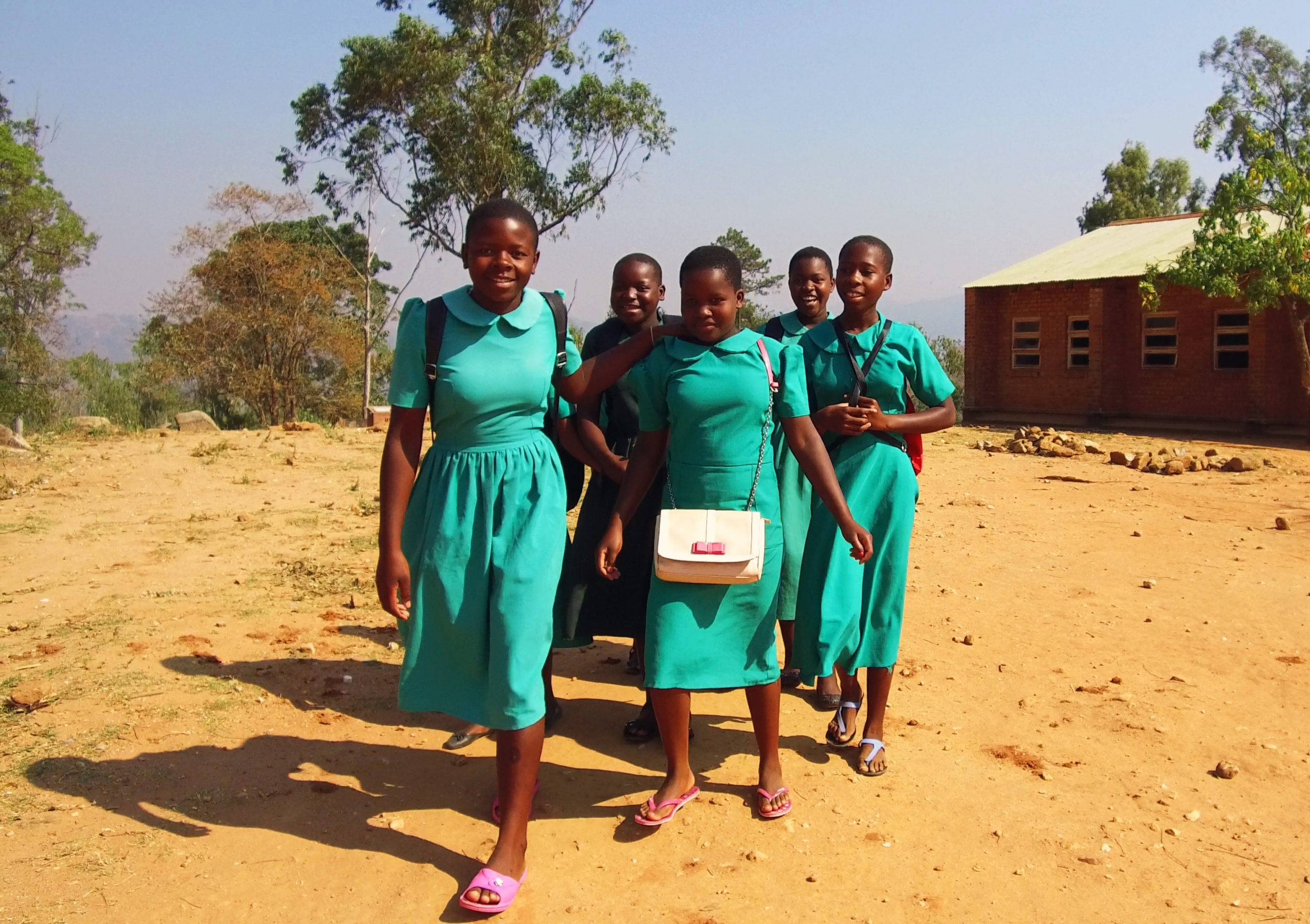 Malawi, teal uniforms, dusty path, 2K Desktop Wallpaper