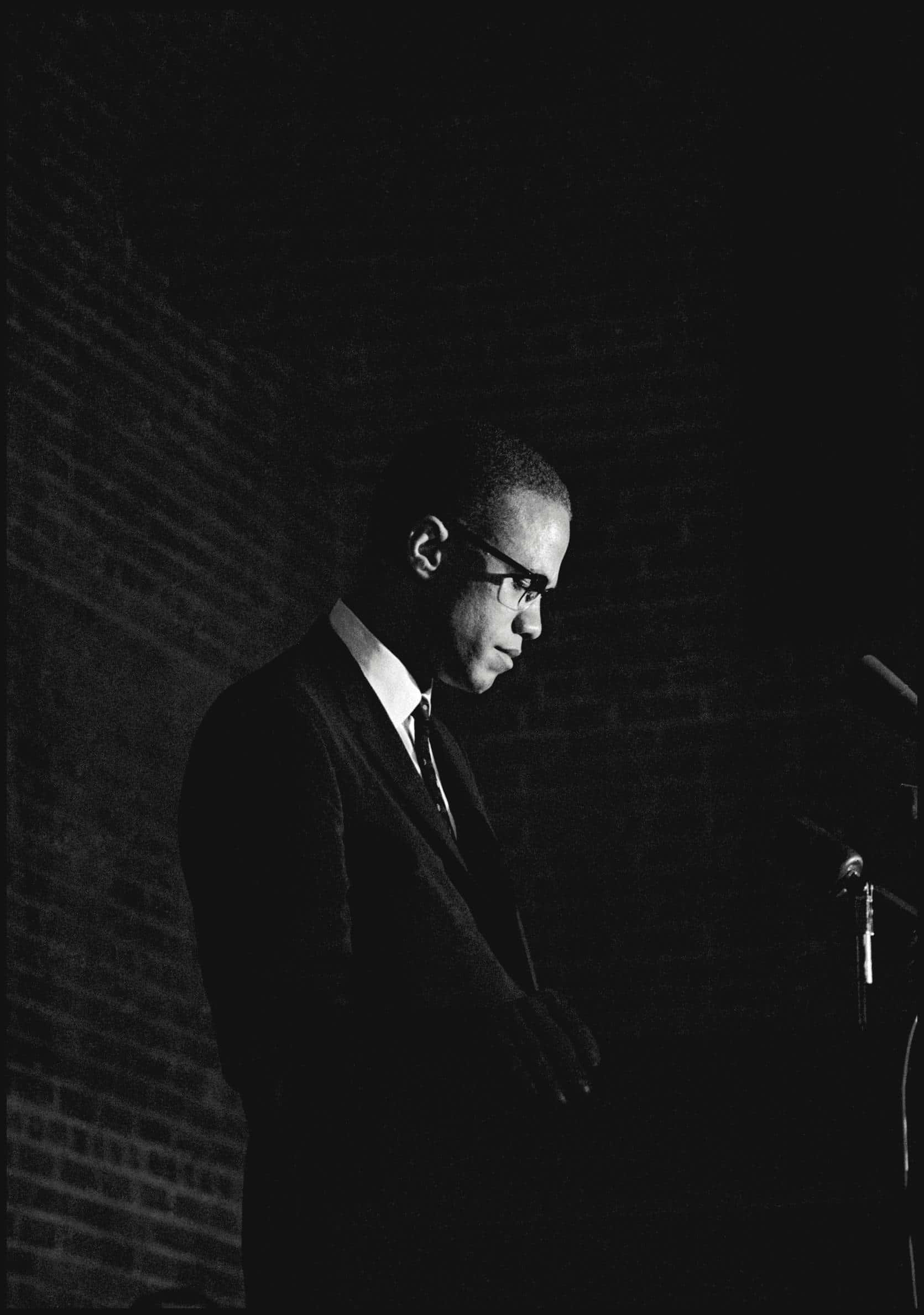 Malcolm X, podium, brick wall, Full HD Phone Wallpaper