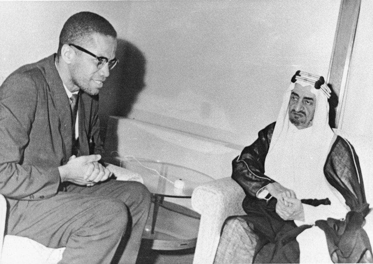 Malcolm X, man in traditional Arab attire, chairs, HD Desktop Wallpaper