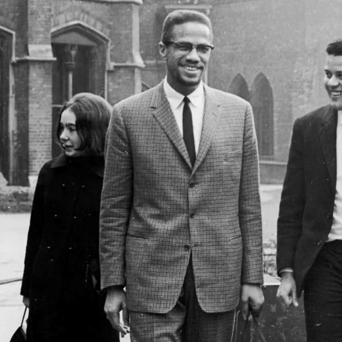 Malcolm X, checkered suit, brick building, SD Desktop Wallpaper