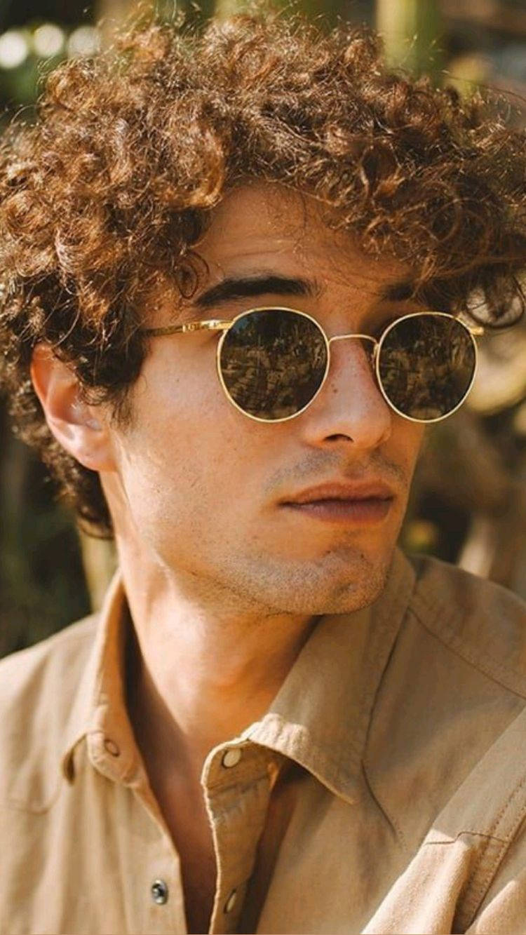 curly brown hair, round gold-rimmed sunglasses, warm sunlight, HD Phone Wallpaper