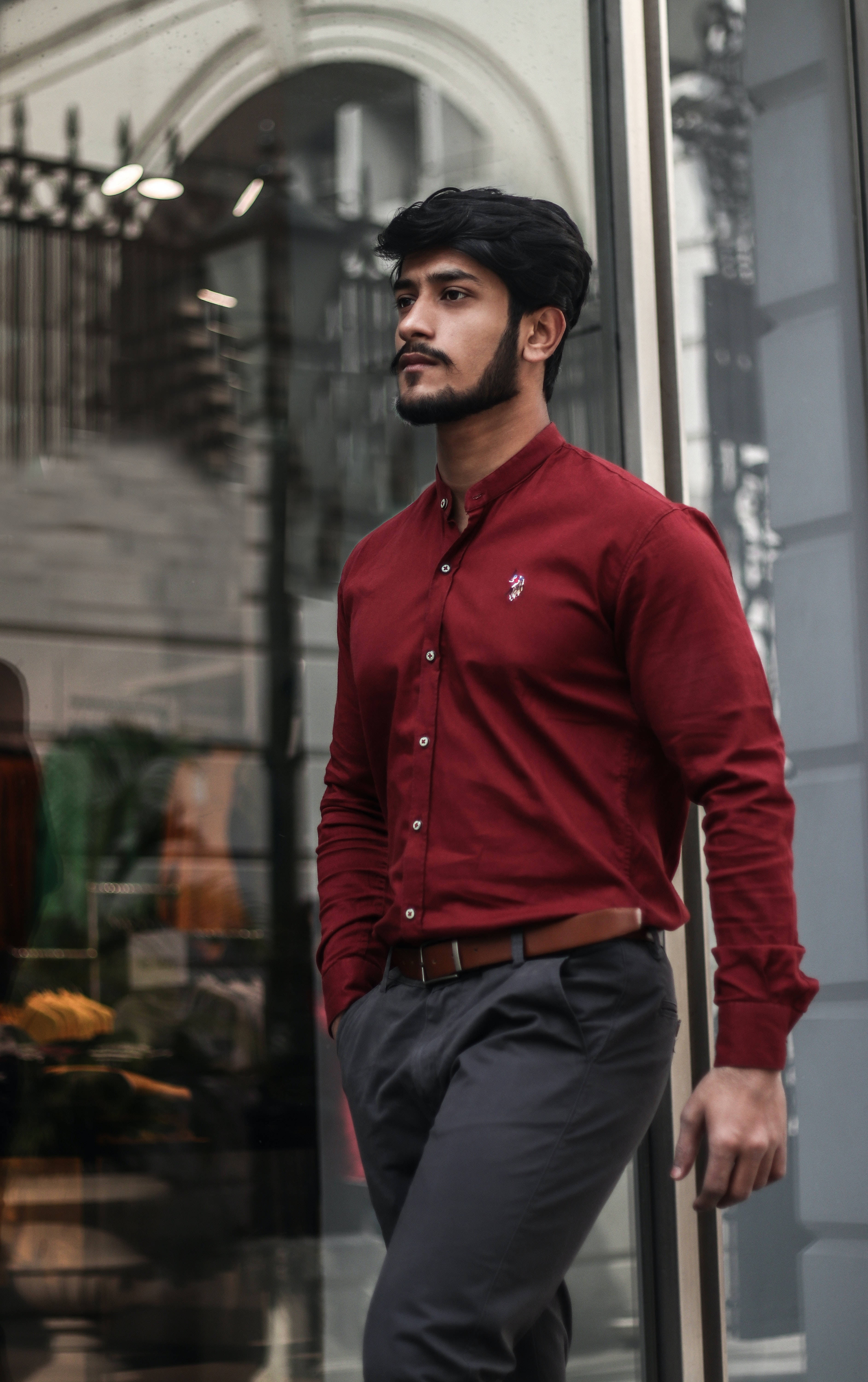 male model, red button-up shirt, glass storefront, 5K Phone Wallpaper