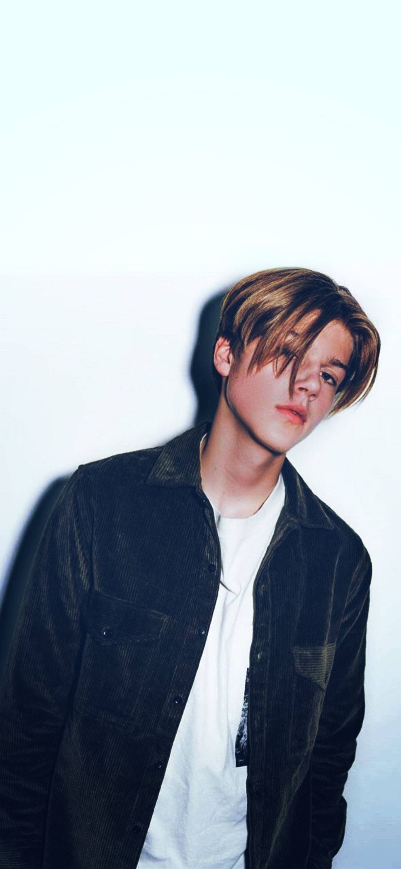 young man, tousled hair, dark corduroy jacket, 2K Phone Wallpaper