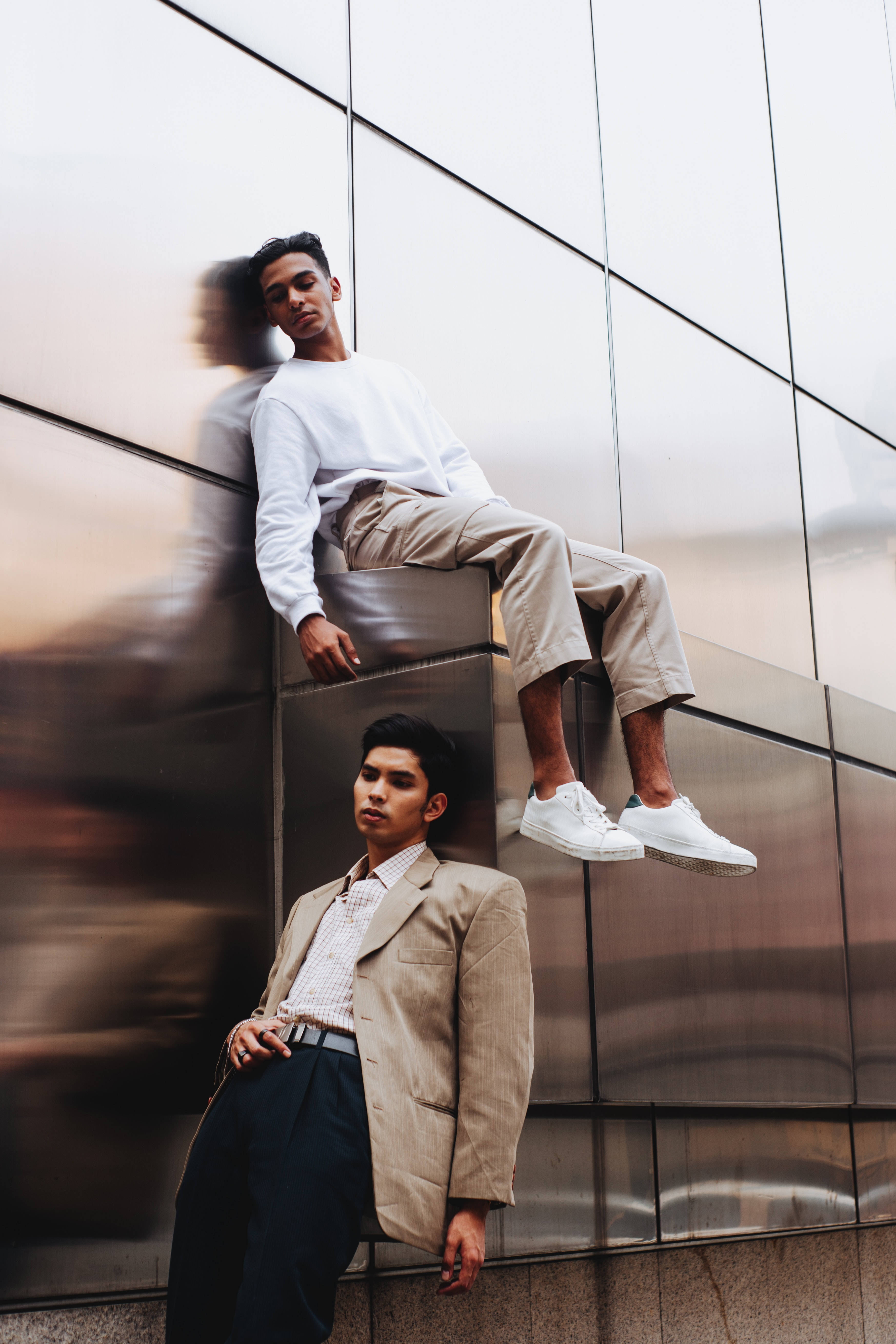 Modeling Man Aesthetic, reflective metallic building facade, blurred motion, 5K Phone Wallpaper
