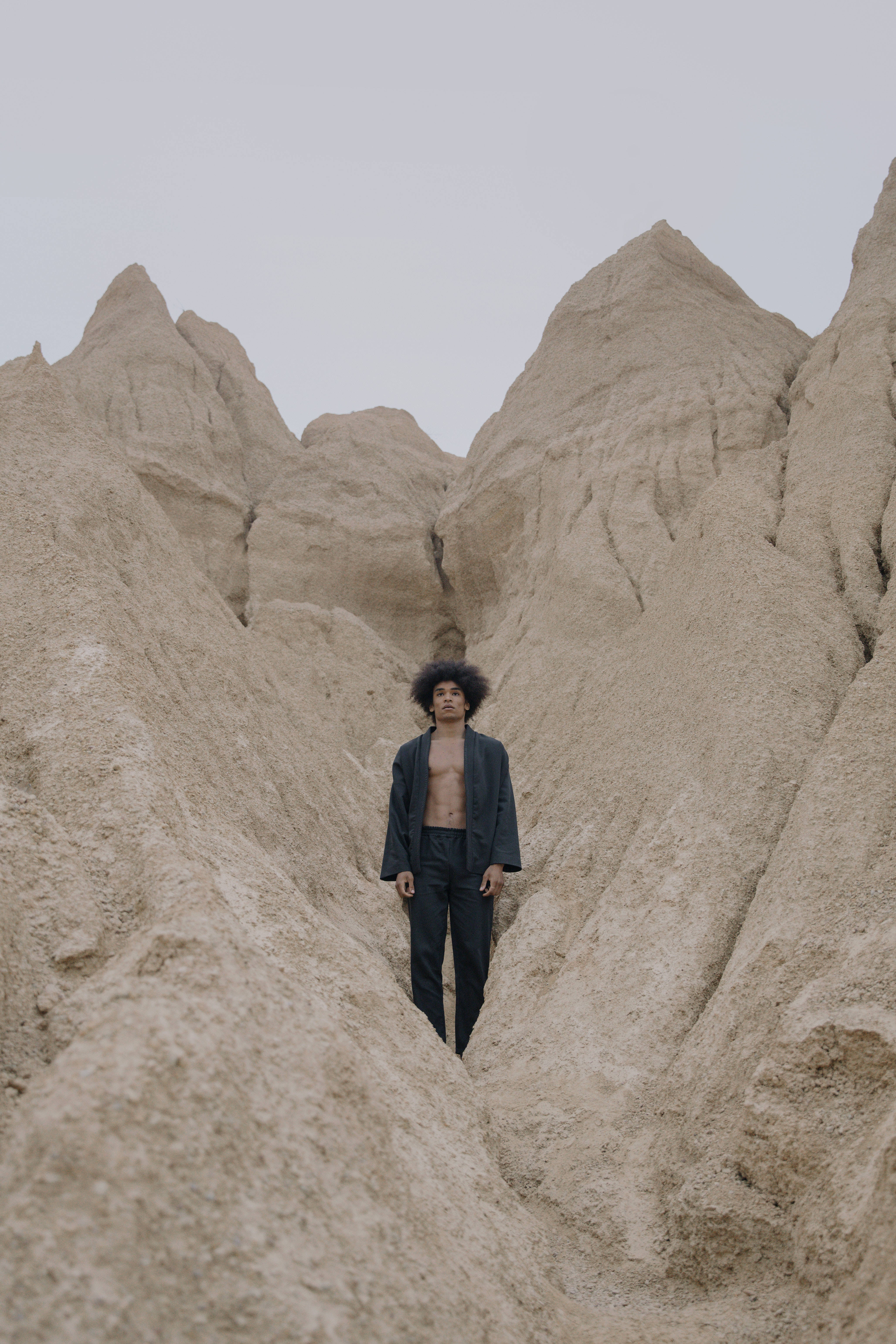 Man Aesthetic, afro, beige sandstone formations, 5K Phone Wallpaper