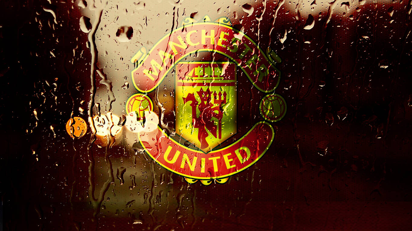 Manchester United crest, rain-splattered window, warm glowing lights, HD Desktop Wallpaper