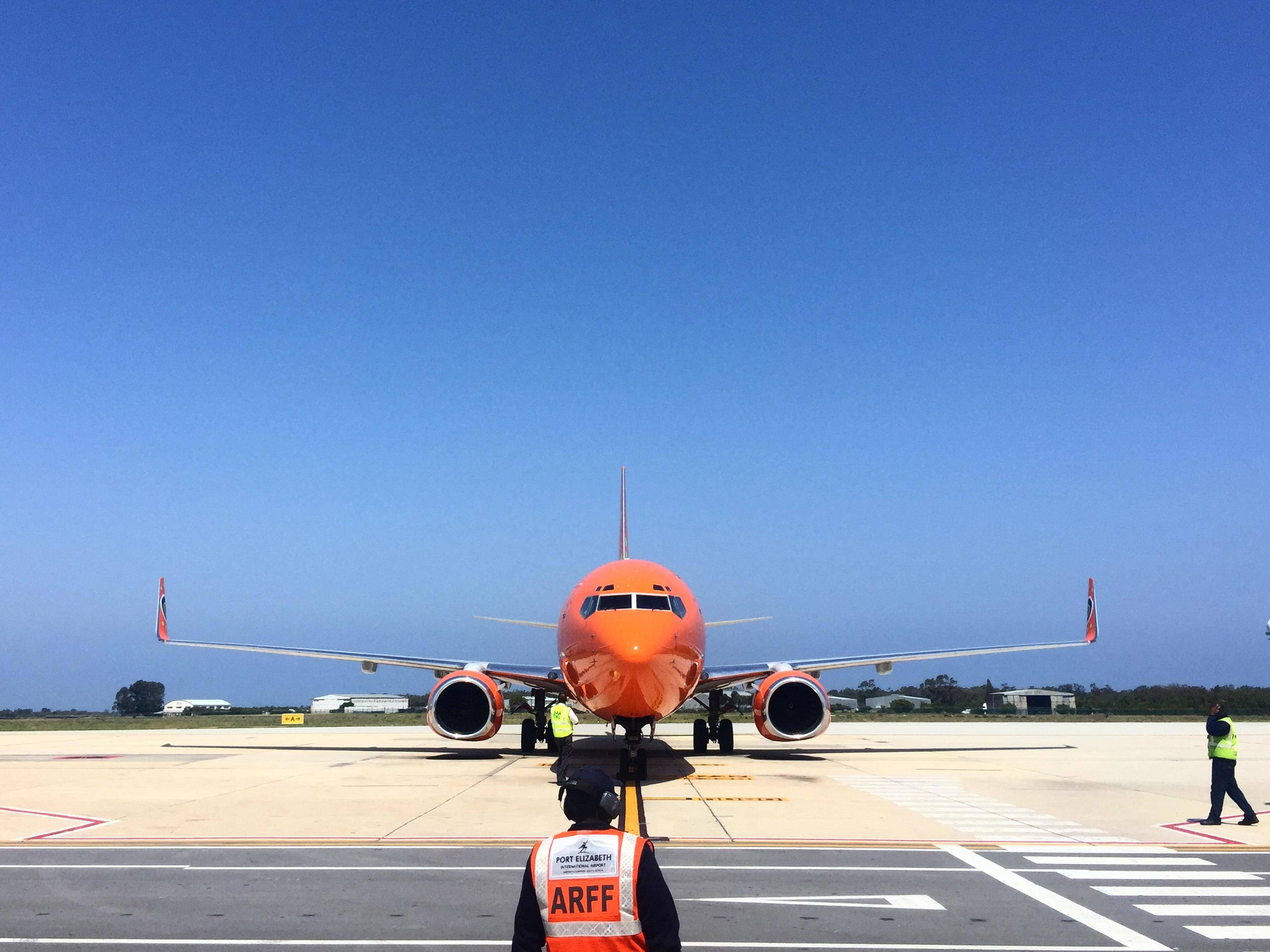 Mango Airlines, bright orange airplane, sunny tarmac, 2K Desktop Wallpaper