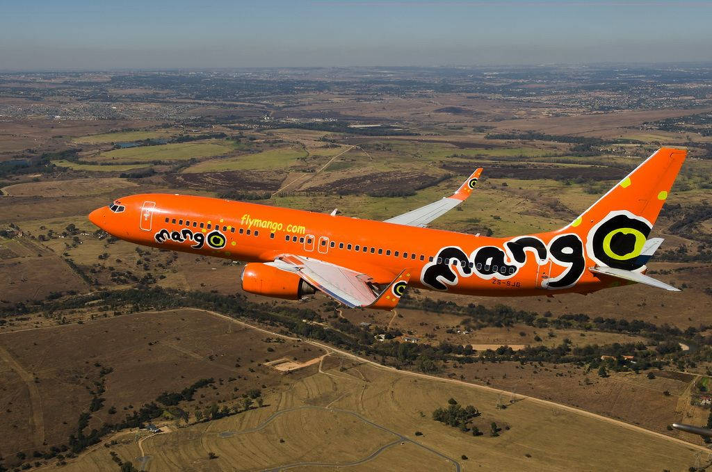 Mango Airlines, orange airplane, cityscape, SD Desktop Wallpaper