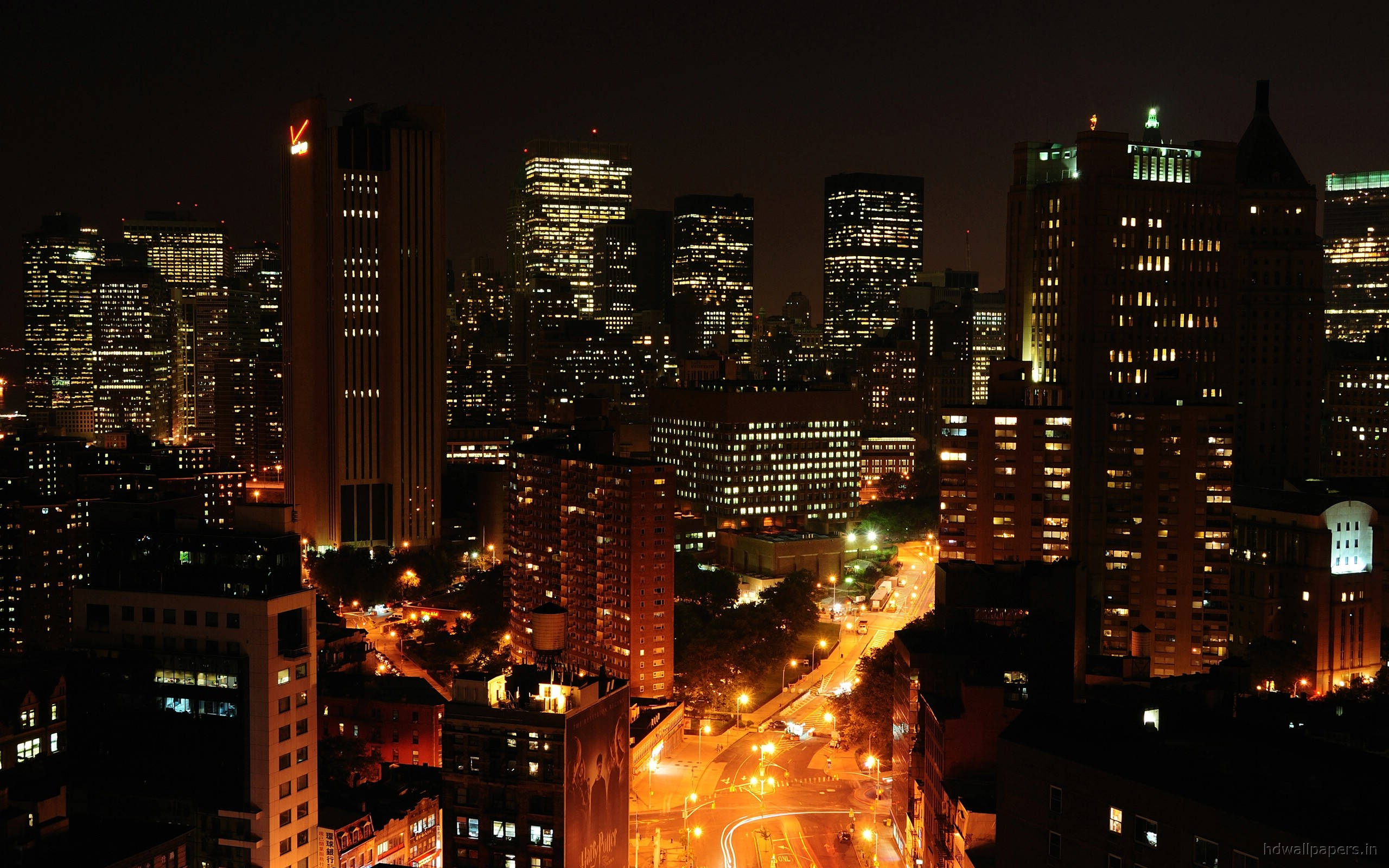 Manhattan, nighttime cityscape, towering skyscrapers, 2K Desktop Wallpaper