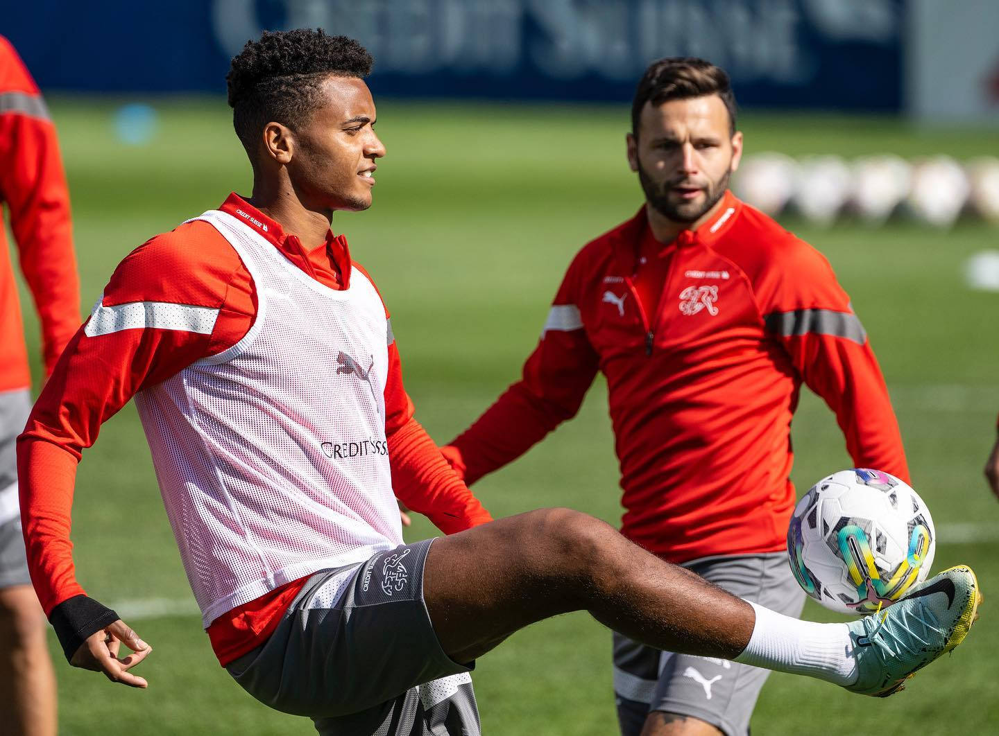 Manuel Akanji, red and white training gear, colorful ball, HD Desktop Wallpaper