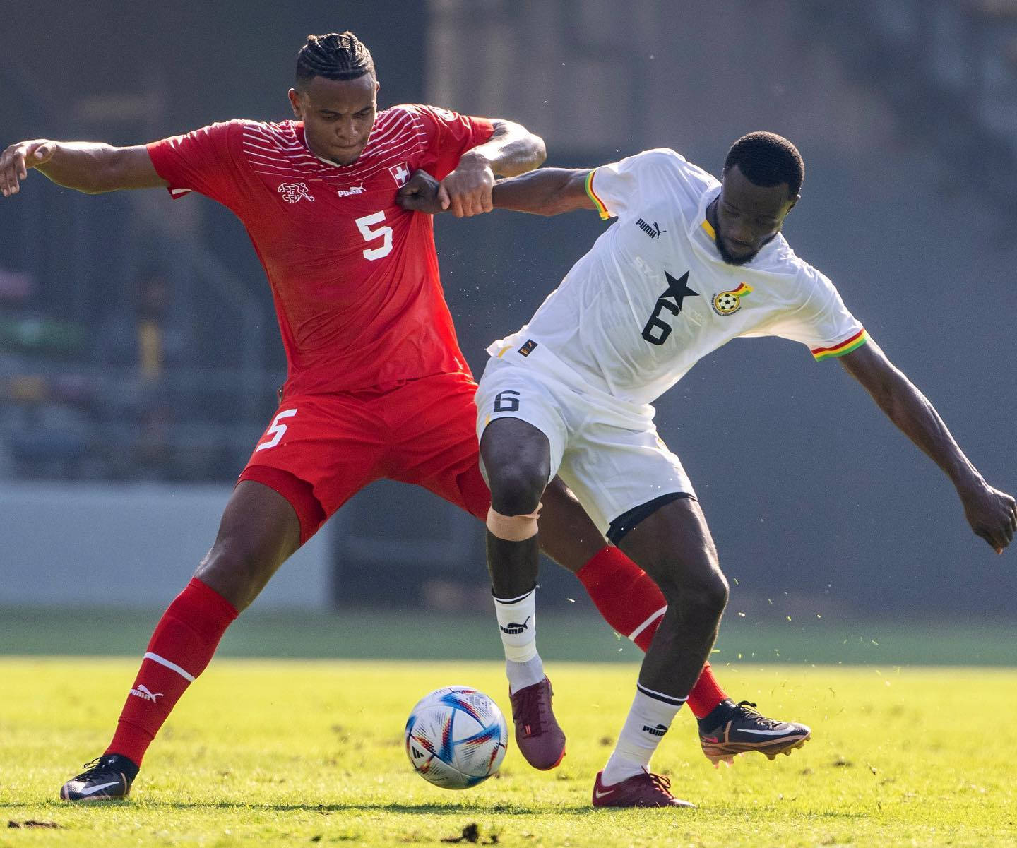 Manuel Akanji, red and white jerseys, sunlit grass field, HD Desktop Wallpaper
