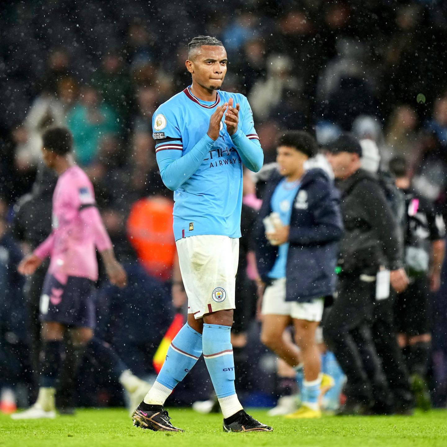 Manuel Akanji, light blue jersey, rain-slicked field, HD Desktop Wallpaper