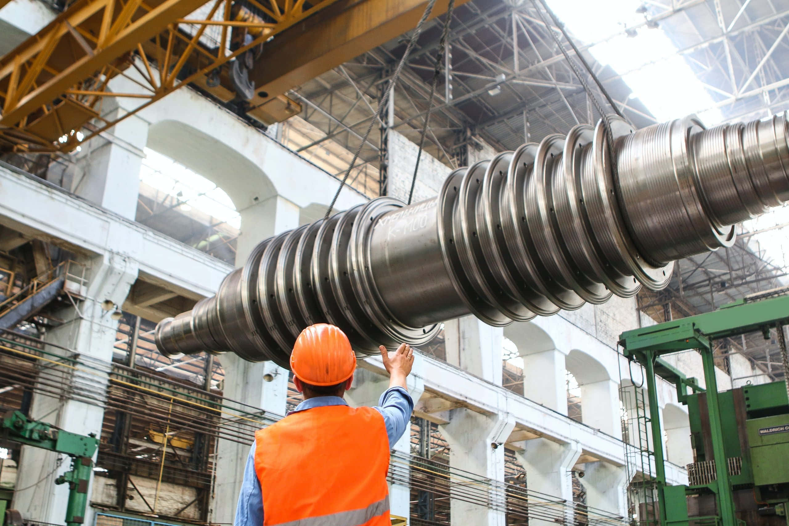 orange vest, massive metallic turbine rotor, crane, 2K Desktop Wallpaper