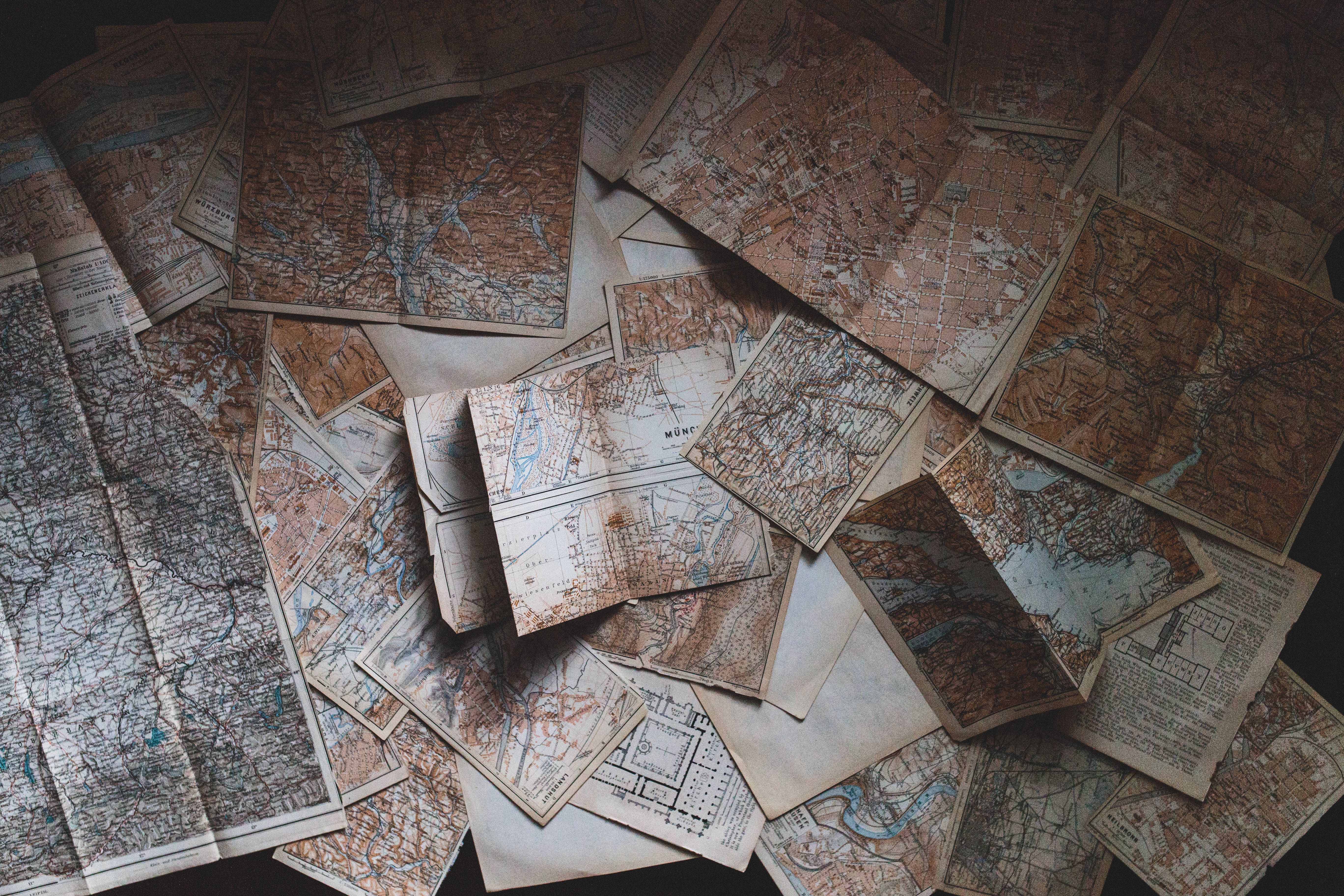 vintage sepia-toned paper maps, faded ink lines, blue waterways, 5K Desktop Wallpaper