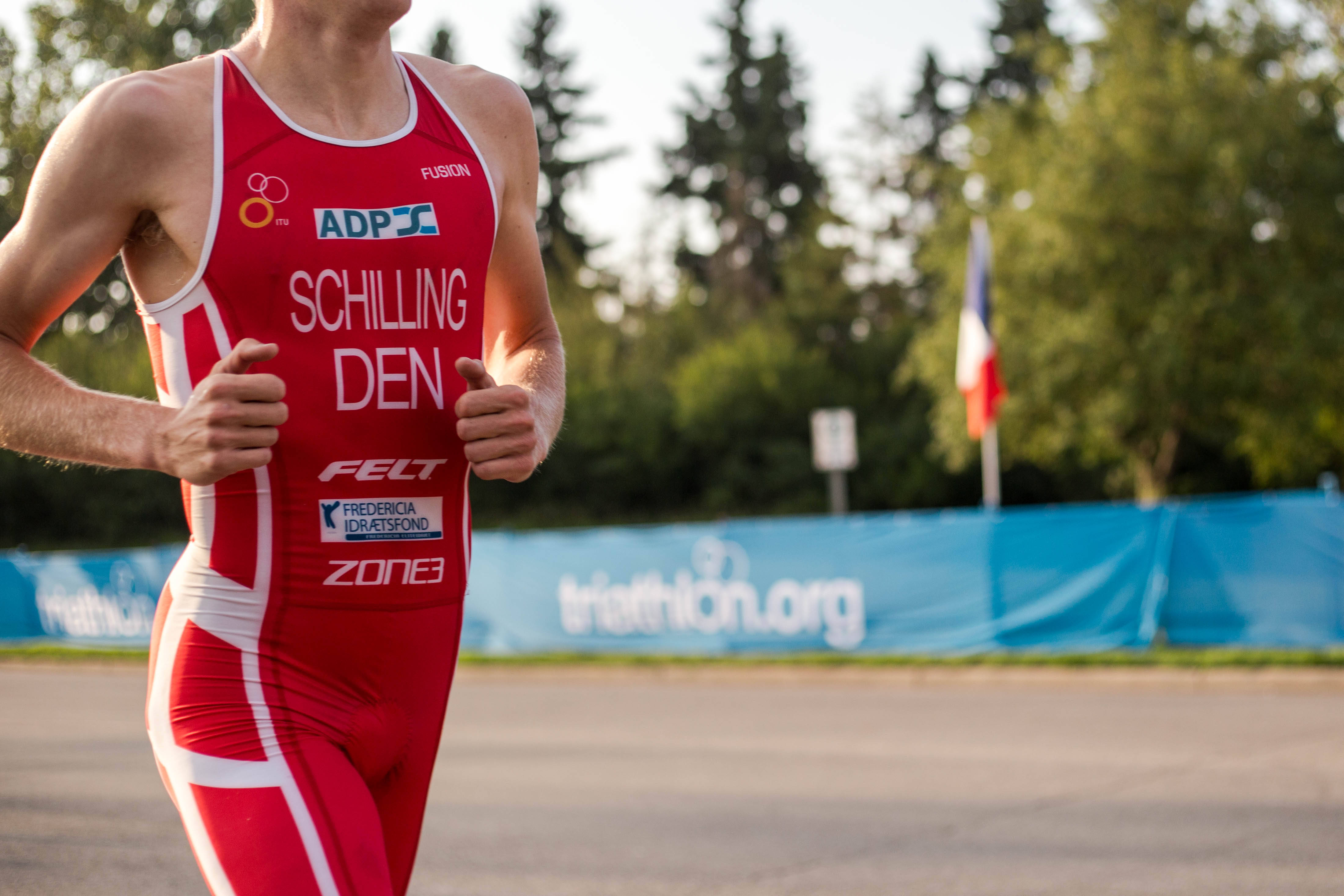 Man In Red Marathon, red and white suit, paved path, 4K Desktop Wallpaper