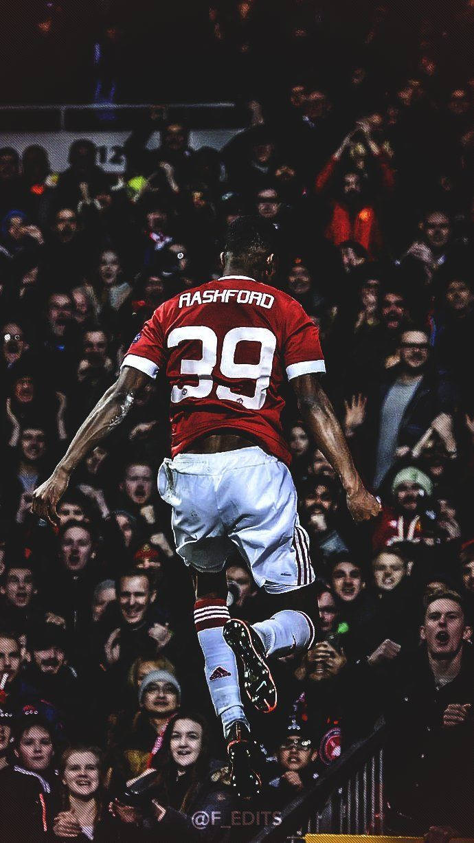 Marcus Rashford, red 39 jersey, roaring stadium crowd, SD Phone Wallpaper