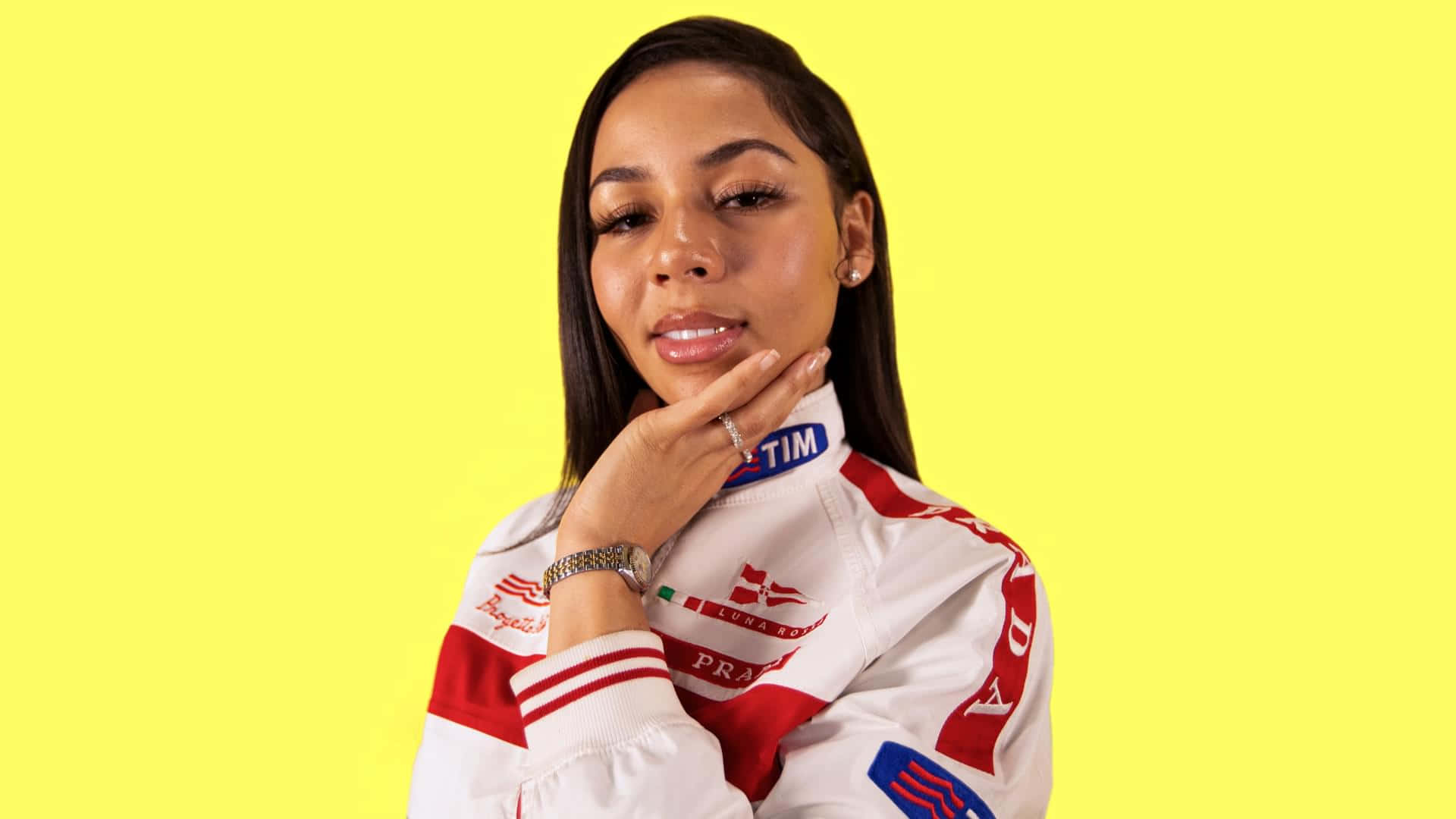 Mariah The Scientist, yellow backdrop, red and white racing jacket, Full HD Desktop Wallpaper