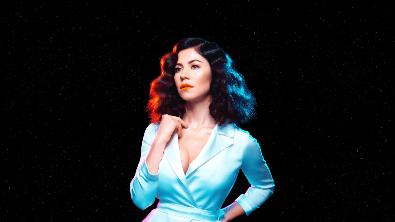 Marina and the diamonds, light blue satin suit, starry black background, HD Desktop Wallpaper