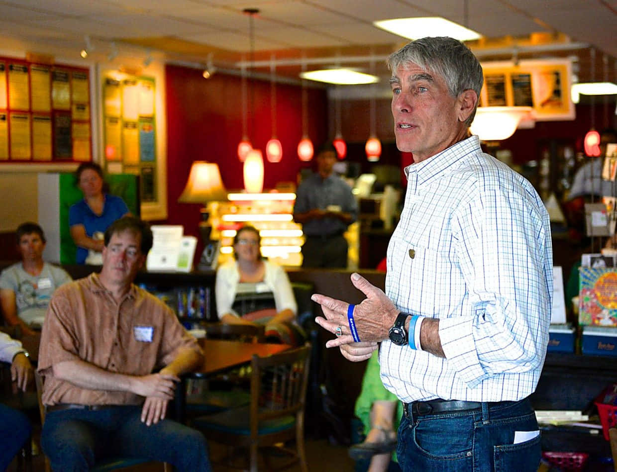 Mark Udall, checkered shirt, red walls, SD Desktop Wallpaper