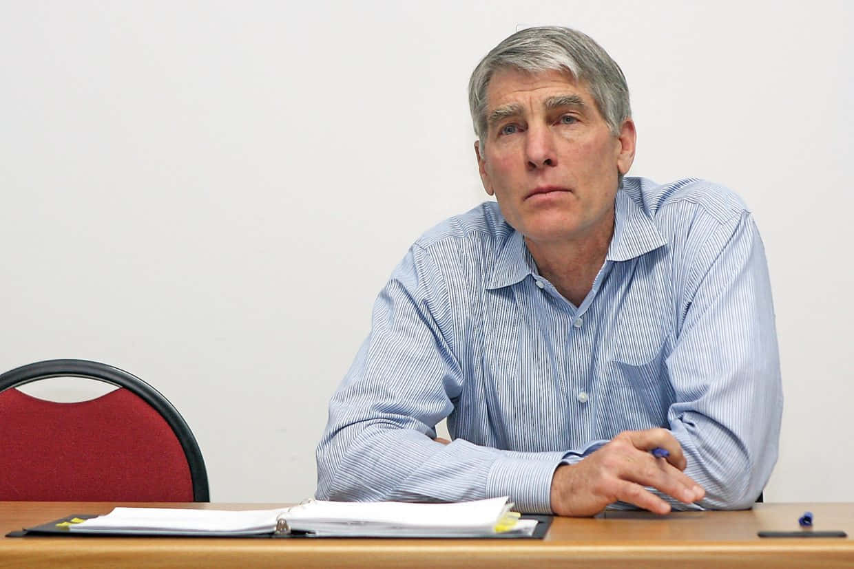 Mark Udall, striped shirt, wooden desk, SD Desktop Wallpaper