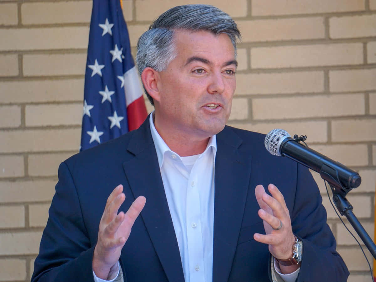 Mark Udall, dark suit, microphone, SD Desktop Wallpaper