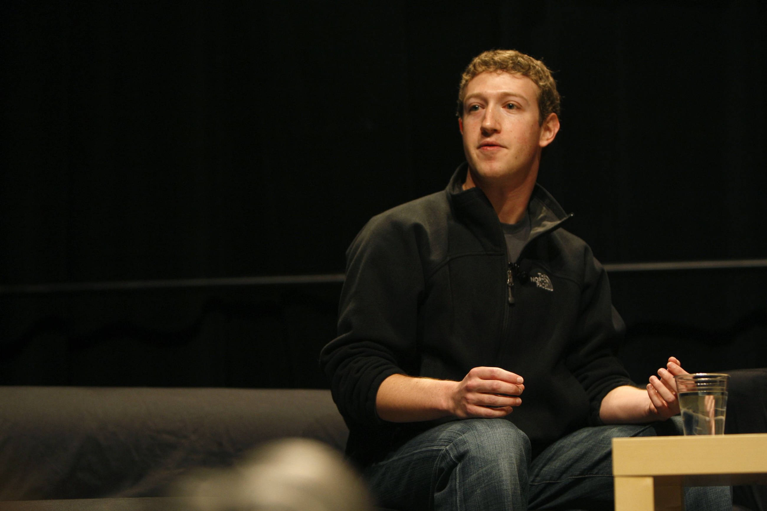 Mark Zuckerberg, black fleece jacket, couch, 2K Desktop Wallpaper