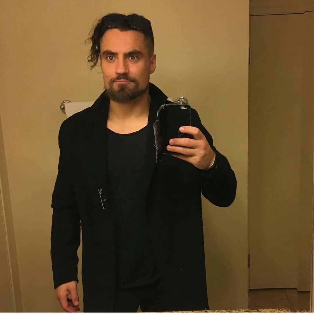 Marty Scurll, black coat, warmly lit bathroom, SD Desktop Wallpaper